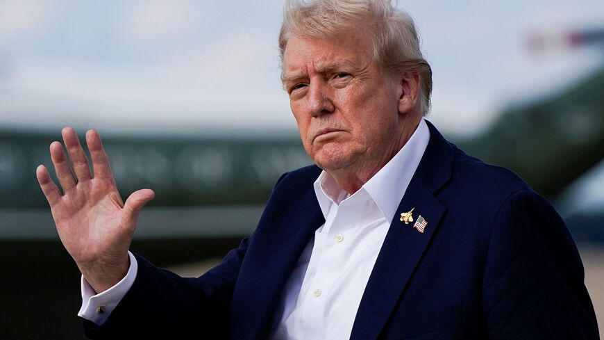U.S. President Donald Trump gestures, as he arrives at Joint Base Andrews, Maryland, U.S., September 26, 2025. REUTERS/Elizabeth Frantz/File Photo