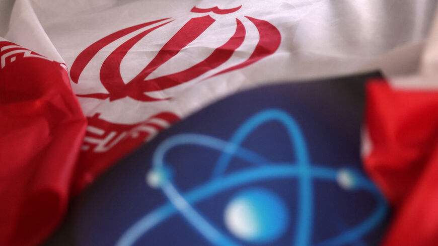 Atomic symbol and Iranian flag are seen in this illustration taken September 8, 2022. REUTERS/Dado Ruvic/Illustration