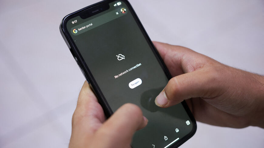 A man tries to use Google on his smartphone amid total telecom shutdown across the country, in Kabul, Afghanistan, September 30, 2025. REUTERS/Sayed Hassib