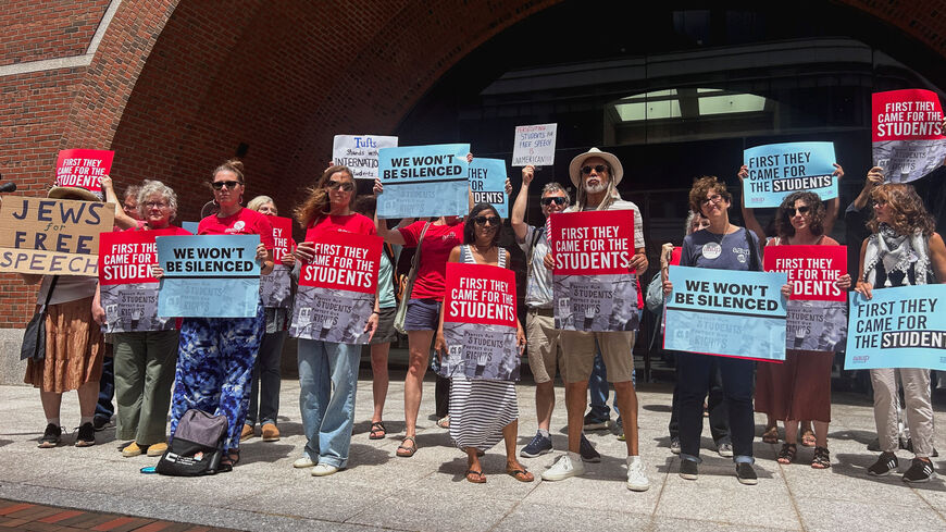 Demonstrators stand outside the federal courthouse after the first day of a trial in a lawsuit filed by the American Association of University Professors and others, which challenges the U.S. President Donald Trump administration's arrest and deportation of pro-Palestinian campus activists, in Boston, Massachusetts, U.S., July 7, 2025. REUTERS/Nate Raymond