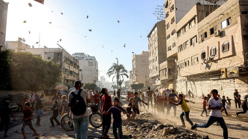 Israeli planes dropped leaflets on Gaza City telling people to leave