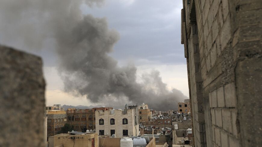 Smoke billows over Sanaa after Israel strikes Huthi targets in the rebel-held Yemeni capital.