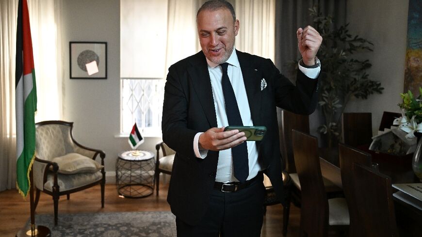 Head of the Palestine Mission to the UK, Husam Zomlot, celebrates after Starmer formally recognised a Palestinian state