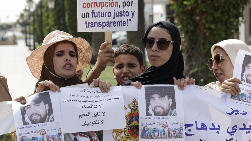 Moroccan survivors of the 2008 earthquake protest their exclusion from the governmental compensation schemes in front of the parliament building in Rabat