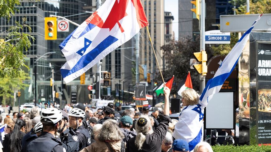Pro-Israel and pro-Palestinian protestors in Toronto before the world premiere of "The
Road Between Us: The Ultimate Rescue”