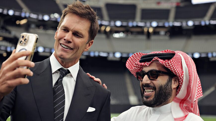 Tom Brady and head of Saudi Arabia’s General Entertainment Authority, Turki al-Sheikh, unveil the flag football tournament in Las Vegas on Sept. 17, 2025.