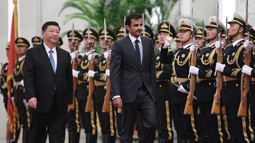 Qatar's Emir Tamim bin Hamad al-Thani (C) reviews a military honour guard with Chinese President Xi Jinping (L) during a welcoming ceremony in Beijing's Great Hall of the People on January 31, 2019. (GREG BAKER/AFP via Getty Images)