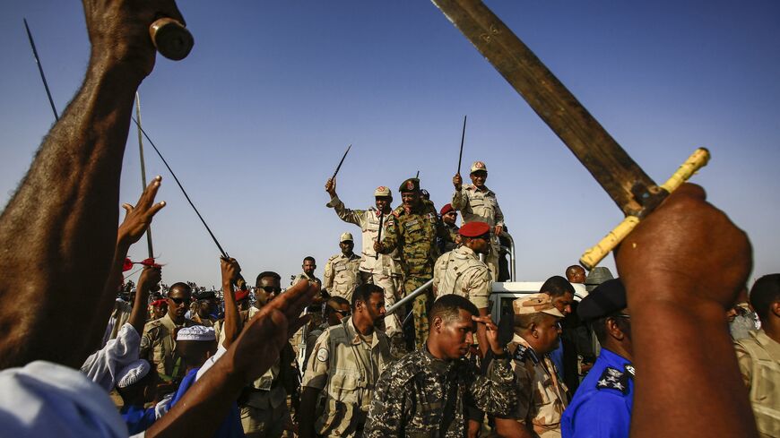 Mohamed Hamdan Dagalo (C-R).