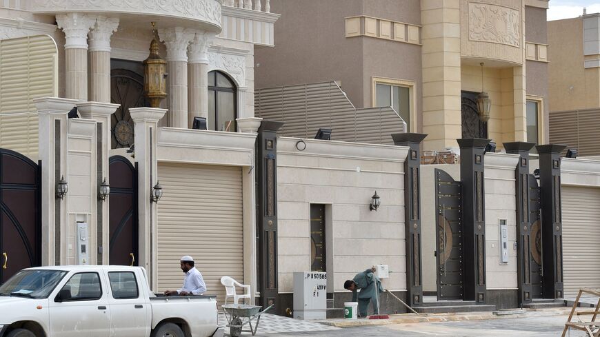 Foreign laborers work on the construction of new luxury houses in the Saudi capital, Riyadh, on April 13, 2019. 