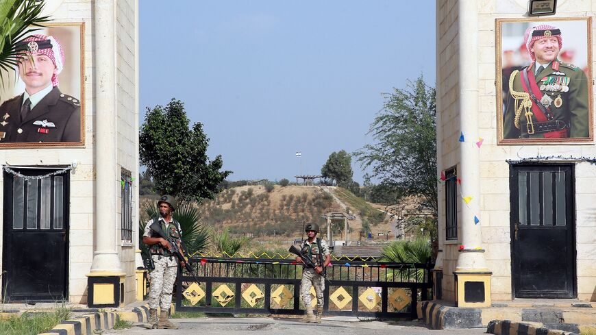 Jordanian soldiers stand guard near the "Gate of Peace" at the Jordan Valley site of Baqura, east of the Jordan River, on Nov. 13, 2019.