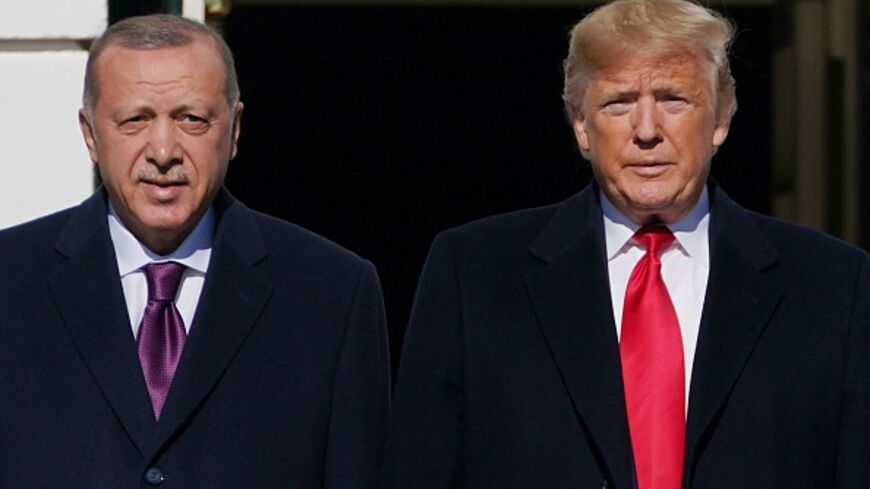 US President Donald Trump greets Turkey's President Recep Tayyip Erdogan outside the White House in Washington, DC on November 13, 2019. (MANDEL NGAN/AFP via Getty Images)