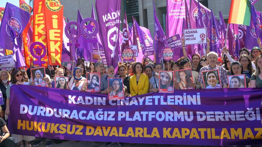 Women's rights activists and relatives of victims of feminicide wait outside the Istanbul court ahead of a hearing on June 1, 2022. 