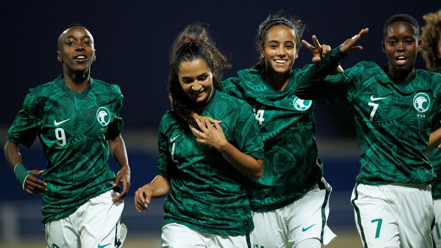 Saudi Arabia's Bayan Sadagah (C-L) celebrates her goal during a friendly football match between Saudi Arabia and Bhutan at Prince Sultan bin Abdulaziz stadium in Abha on September 24, 2022. (Photo by AFP) (Photo by -/AFP via Getty Images)