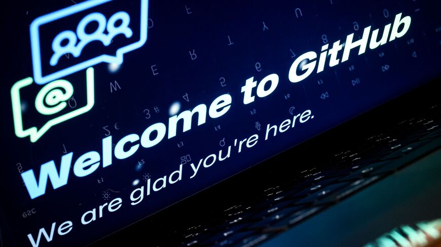  A photo illustration shows a laptop screen displays welcome screens and messages on the Github developer platform website, on February 23, 2024 in London, England. 