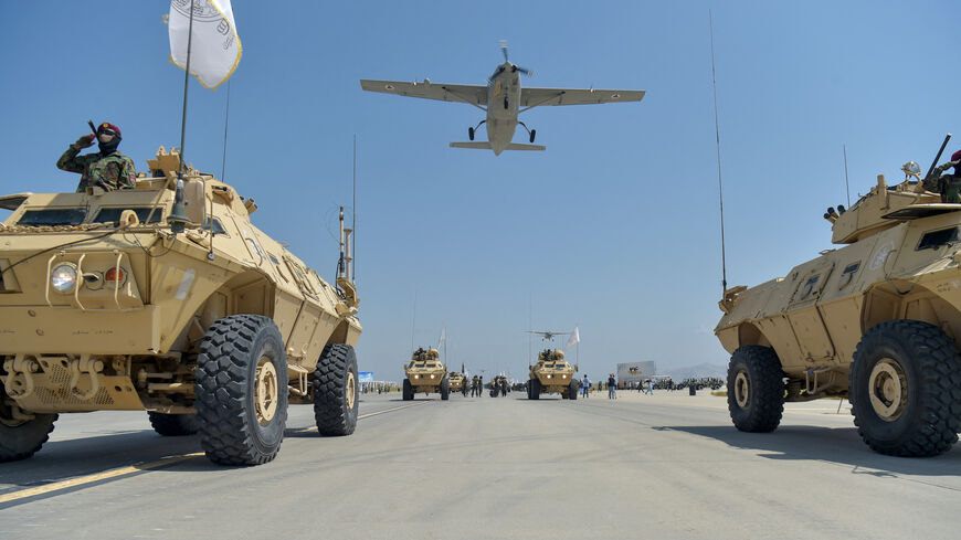 Taliban military vehicles parade to celebrate the third anniversary of Taliban's takeover of Afghanistan, at the Bagram Air Base, in Bagram, Parwan province on Aug. 14, 2024.