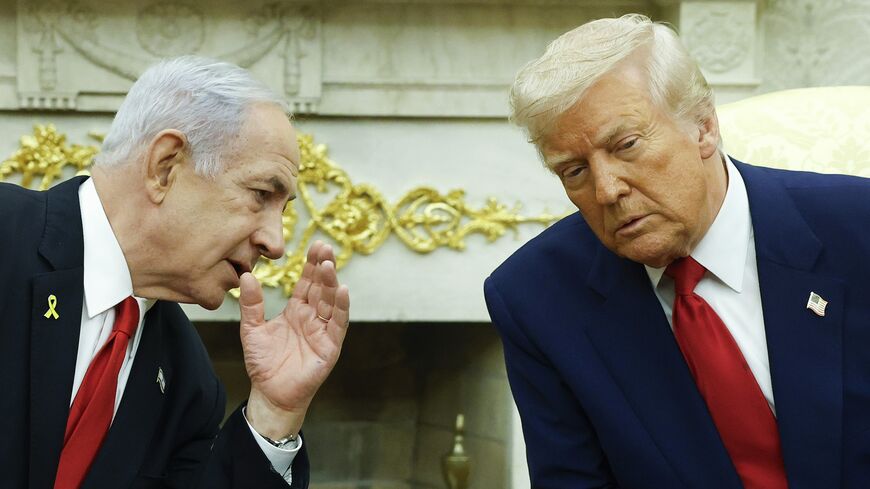 Israeli Prime Minister Benjamin (L) talks to US President Donald Trump during a meeting in the Oval Office of the White House on April 7, 2025, in Washington. 