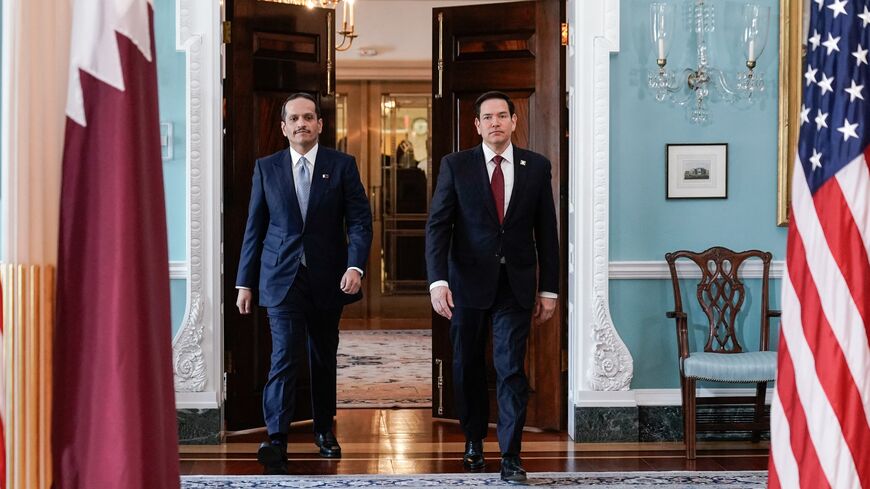 US Secretary of State Marco Rubio walks with Qatari Prime Minister and Foreign Minister Sheikh Mohammed bin Abdulrahman bin Jassim Al Thani as they meet at the Department of State in Washington, on April 22, 2025.