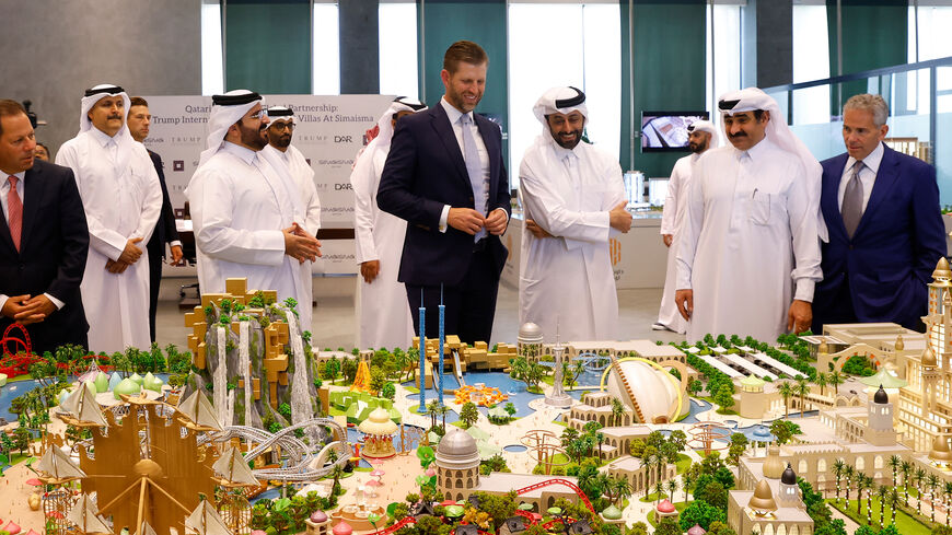 Eric Trump, executive vice president of the Trump Organization and the US president's son, looks over the proposed plan ahead of the signing ceremony with Qatar's Diar and Dar Global, Doha, Qatar, April 30, 2025.