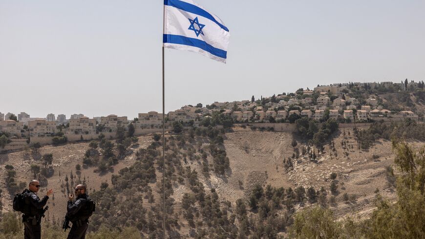 Israeli policemen stand guard near the settlement of Maale Adummim, in a land corridor known as E1, outside Jerusalem in the occupied West Bank on Aug. 14, 2025.