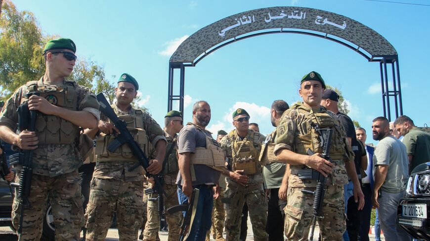 Lebanese soldiers stand guard outside an army base in the southern city of Tyre, on Aug. 28, 2025.