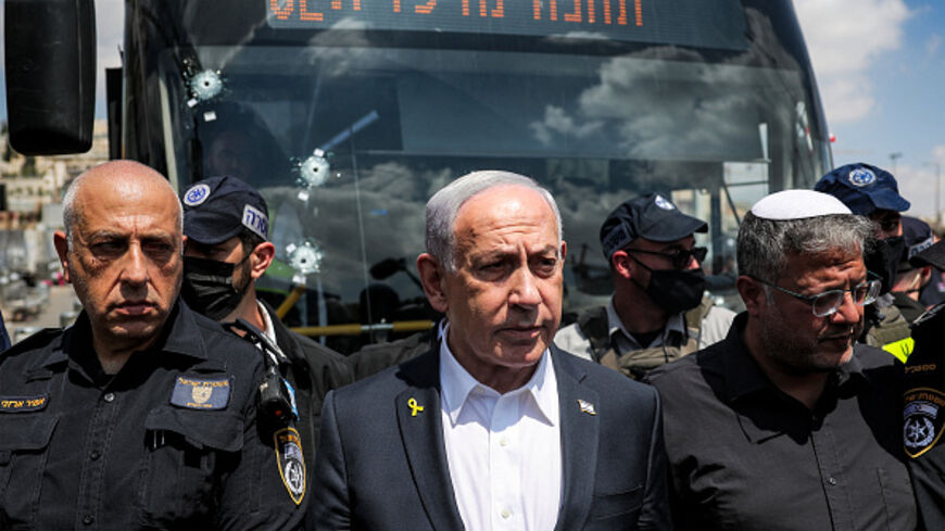 TOPSHOT - Israel's Prime Minister Benjamin Netanyahu (C) and National Security Minister Itamar Ben-Gvir (R) visit the scene of a shooting at the Ramot road junction in Israeli-annexed east Jerusalem on September 8, 2025. Palestinian gunmen opened fire at a bus stop in Israeli-annexed east Jerusalem on September 8, killing five people and wounding several others. Israeli emergency service Magen David Adom (MDA) said there were five victims dead in the shooting attack, updating an earlier toll of four. Police