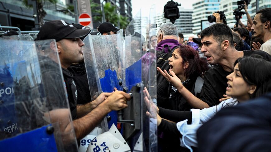 Protesters clash with Turkish anti-riot police officers near the Istanbul Province headquarters of Turkey's main opposition party Republican People's Party (CHP), on Sept. 8, 2025, in Istanbul. 