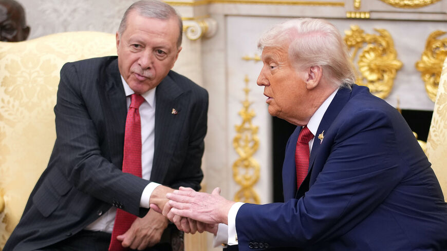 President Donald Trump (R) shakes hands with President of Turkey Recep Tayyip Erdogan during a meeting in the Oval Office at the White House on Sept. 25, 2025 in Washington, DC.