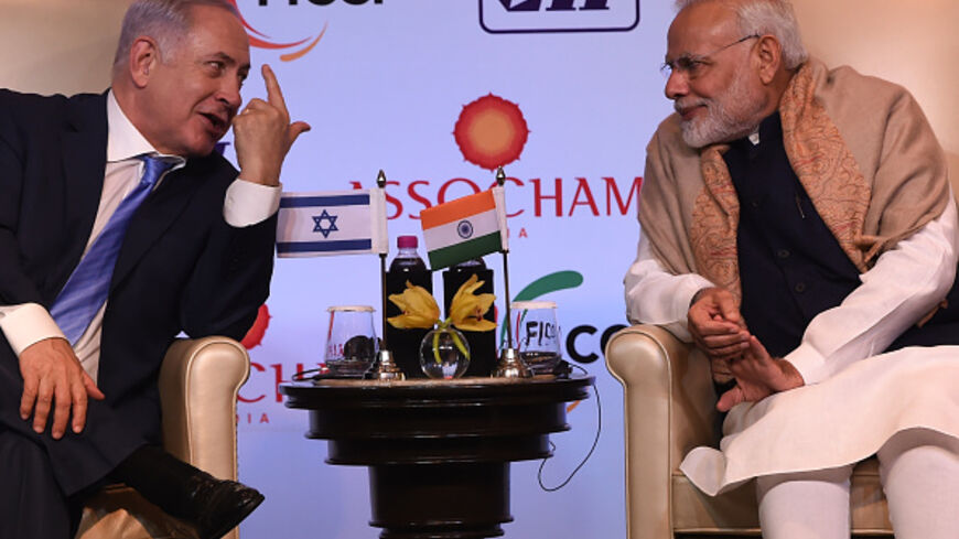 Indian Prime Minister Narendra Modi (R) and Israeli Prime Minister Benjamin Netanyahu talk during the India-Israel Business Summit in New Delhi on January 15, 2018. Benjamin Netanyahu hailed a "new era" in ties with India on January 15 as he signed a series of deals during the first visit by an Israeli Prime Minister in 15 years. Netanyahu made the comment after talks with Narendra Modi, who made history in July when he became the first Indian leader ever to visit Israel.
