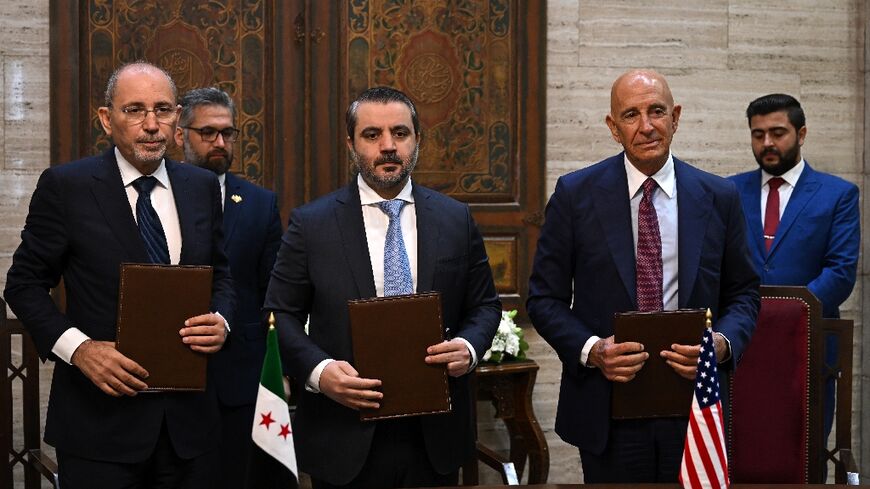 Syrian Foreign Minister Asaad al-Shaibani (C), along with representatives of the US and Jordan, unveils a new roadmap for stability in violence-hit Sweida