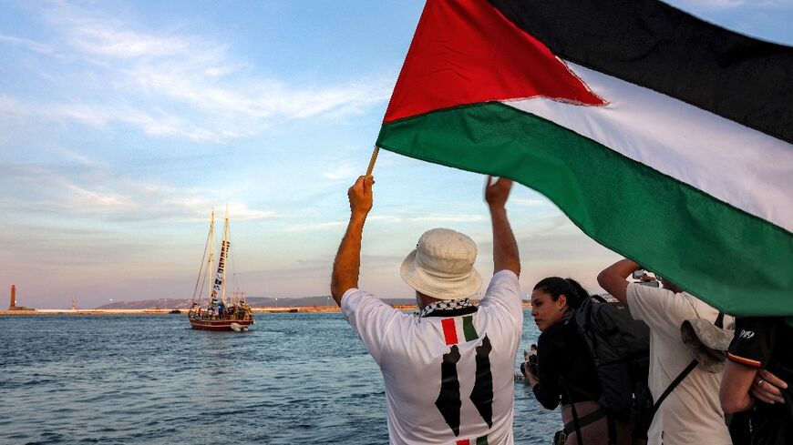 Activists see off boats in the Gaza aid flotilla departing from Tunisia's northern port of Bizerte on September 14, 2025