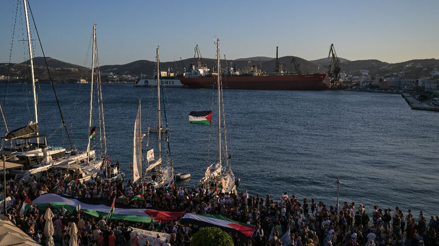 Around 500 people gathered at the port of Ermopoulis to see off the two Greece-flagged boats