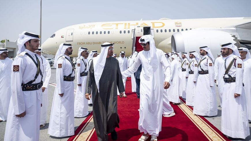 Sheikh Tamim bin Hamad Al Thani (L) welcomes Sheikh Mohammed Bin Zayed Al Nahyan (R) to Hamad International Airport in Doha, on Sept. 10, 2025.