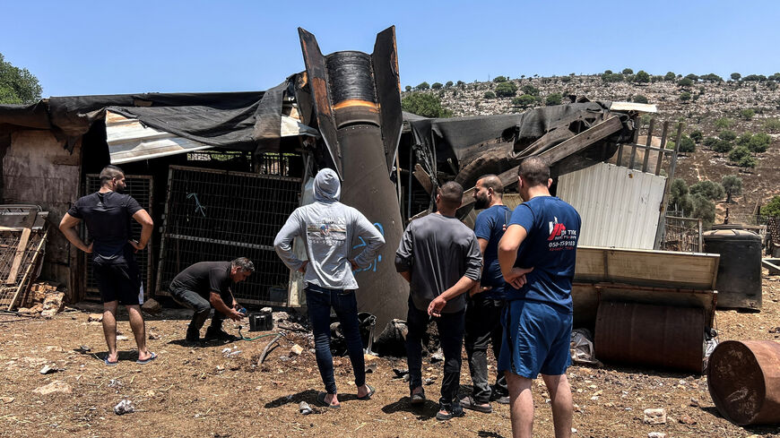 People look at an apparent remains of a ballistic missile following today's missile attack by Iran on Israel, in northern Israel, June 24, 2025. REUTERS/Avi Ohayon