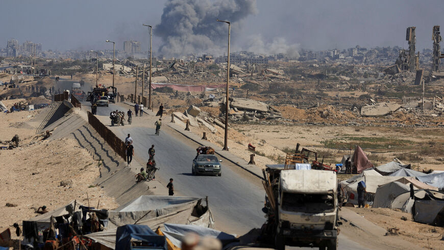 Smoke rises during an Israeli military operation as displaced Palestinians fleeing northern Gaza move southward after Israeli forces ordered residents of Gaza City to evacuate, in the central Gaza Strip, September 30, 2025. REUTERS/Dawoud Abu Alkas