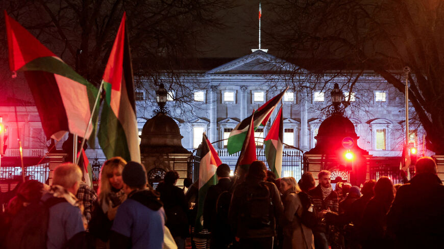 FILE PHOTO: Pro-Palestinian demonstrators hold flags asking for the government to enact to the Occupied Territories Bill, on the day of a breakdown of parliament proceedings to nominate the next Taoiseach (Prime Minister), outside government buildings, in Dublin, Ireland January 22, 2025. REUTERS/Emilija Jefremova/File Photo