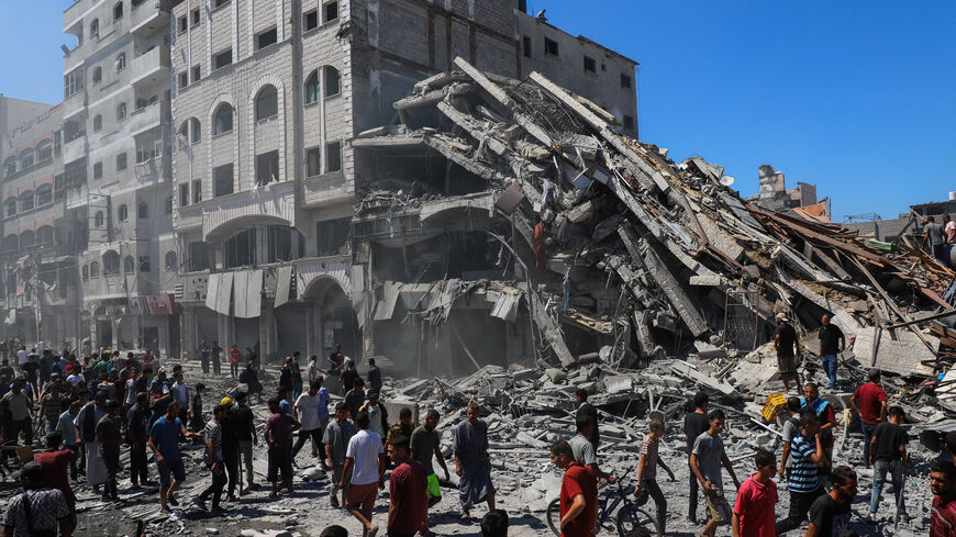 Palestinians inspect the site of an evacuated house, after it was hit by an Israeli air strike, in Gaza City, September 12, 2025. REUTERS/Ebrahim Hajjaj