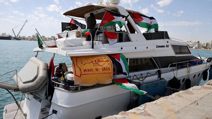 FILE PHOTO: People gather on a boat from a flotilla that had been carrying aid to Gaza until it was intercepted by Israel, docked in the port of Larnaca, Cyprus October 3, 2025. REUTERS/Yiannis Kourtoglou/File Photo