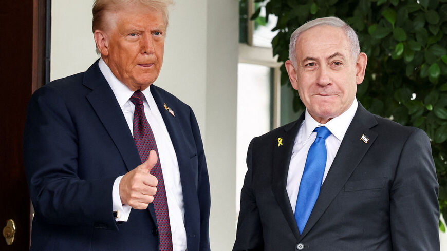 FILE PHOTO: U.S. President Donald Trump gives a thumbs up as he welcomes Israeli Prime Minister Benjamin Netanyahu at the White House in Washington, D.C., U.S., September 29, 2025. REUTERS/Kevin Lamarque/File Photo