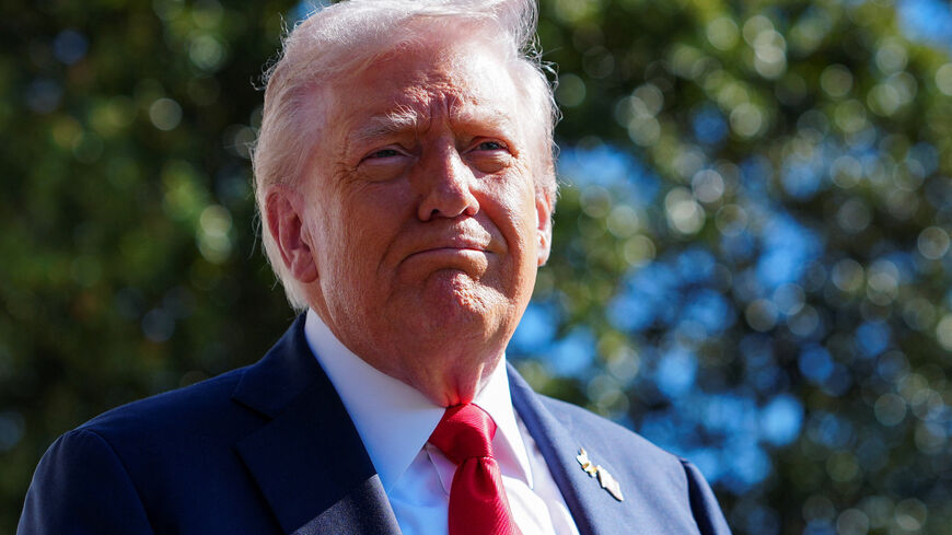 U.S. President Donald Trump looks on as he departs the White House en route to Norfolk, Virginia to attend the 250th Anniversary of the Navy celebration, from the South Lawn at the White House in Washington, D.C., U.S., October 5, 2025. REUTERS/Aaron Schwartz