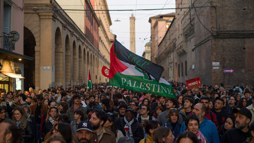 Pro-Palestinian demonstrators carry flags during a protest to condemn the Israeli forces' interception of some of the vessels of the Global Sumud Flotilla aiming to reach Gaza and break Israel's naval blockade, in Bologna, Italy, October 2, 2025. REUTERS/Michele Lapini