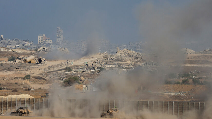 An Israeli military vehicles manoeuvre on the Israeli side of the Israel-Gaza border, as seen from southern Israel, October 7, 2025. REUTERS/Ronen Zvulun
