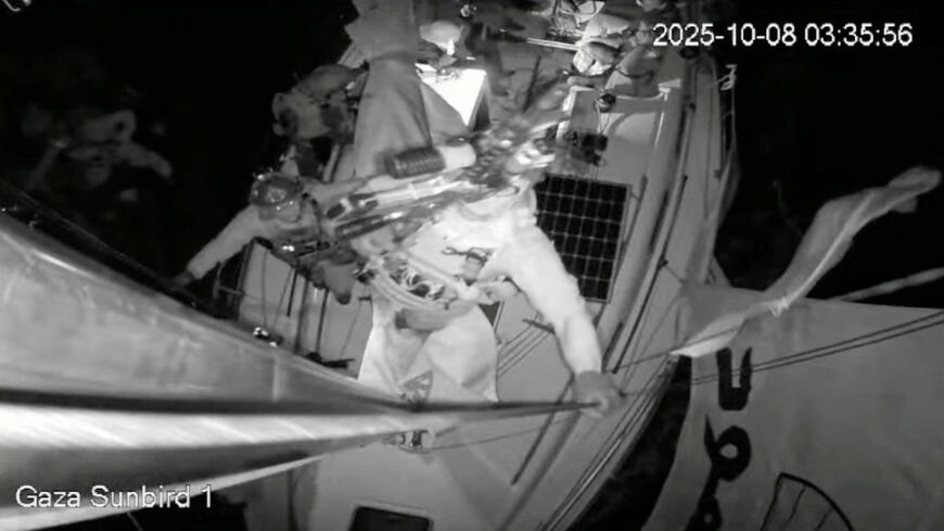 A screengrab from a live footage video shows an Israeli soldier smashing the CCTV camera of "Gaza Sunbird", a Gaza-bound vessel which is part of the Global Sumud Flotilla, with a gun as the boat is intercepted by Israeli security forces, in this screengrab obtained from a video released on October 8, 2025. Freedom Flotilla Coalition/Handout via REUTERS