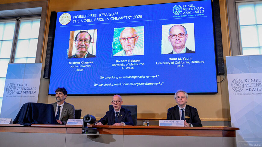 A screen displays the 2025 Nobel Prize laureates in Chemistry, Susumu Kitagawa (Kyoto University, Japan), Richard Robson (University of Melbourne, Australia), and Omar M. Yaghi (University of California, Berkeley, U.S.), as they are announced during a press conference at the Royal Swedish Academy of Sciences in Stockholm, Sweden, October 8, 2025. TT News Agency/Fredrik Sandberg via REUTERS
