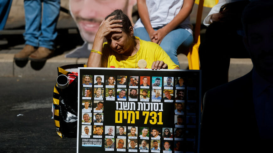 A woman reacts as families of Israeli hostages and supporters protest outside Israeli Prime Minister Benjamin Netanyahu's residence, marking the two-year anniversary of the deadly October 7, 2023 attack on Israel by Hamas from Gaza, in Jerusalem, October 7, 2025. REUTERS/Ammar Awad     TPX IMAGES OF THE DAY