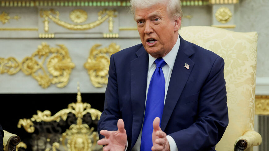 U.S. President Donald Trump speaks as he and Canada's Prime Minister Mark Carney (not pictured) meet in the Oval Office at the White House in Washington, D.C., U.S., October 7, 2025. REUTERS/Evelyn Hockstein