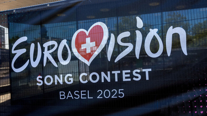 FILE PHOTO: A logo of the Eurovision Song Contest is seen in front of the St. Jakobshalle in Basel, Switzerland, May 1, 2025. REUTERS/Denis Balibouse//File Photo