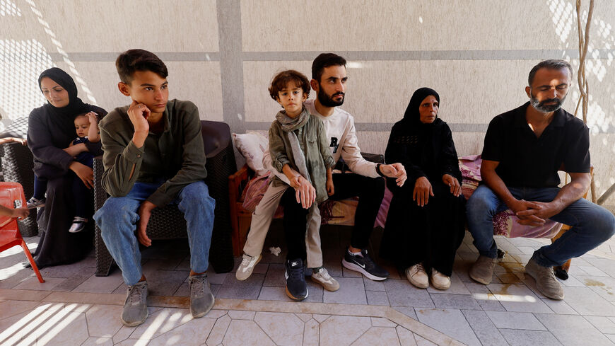 Freed Palestinian detainee Shadi Abu Sido sits with his relatives at their home in Nuseirat, central Gaza Strip, after his release from Israeli detention as part of a ceasefire deal between Hamas and Israel, October 14, 2025. REUTERS/Mahmoud Issa
