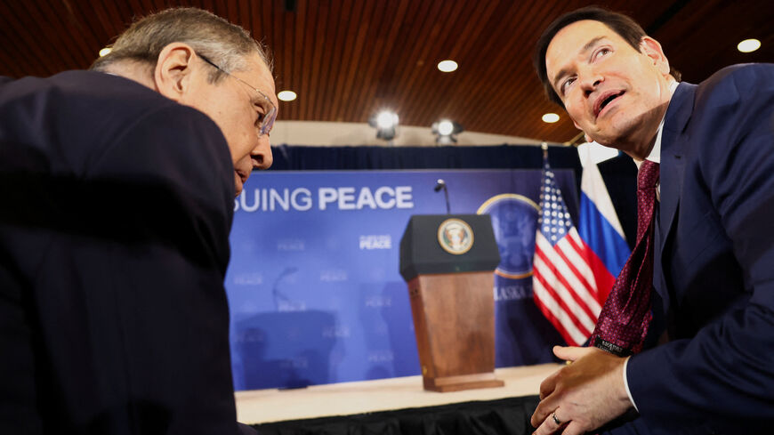Russian Foreign Minister Sergei Lavrov and U.S. Secretary of State Marco Rubio talk as they attend a press conference held by U.S. President Donald Trump and Russian President Vladimir Putin following their meeting to negotiate an end to the war in Ukraine, at Joint Base Elmendorf-Richardson, in Anchorage, Alaska, U.S., August 15, 2025. REUTERS/Kevin Lamarque