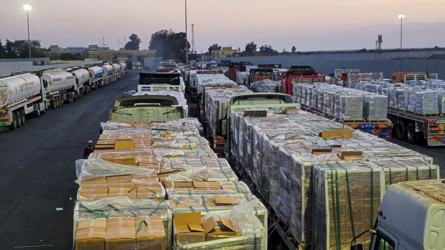 Trucks carrying humanitarian aid and fuel line up at the crossing into the Gaza Strip at the Rafah border on the Egypt side, amid a ceasefire between Israel and Hamas in Gaza, in Rafah, Egypt, October 17, 2025. REUTERS/Stringer