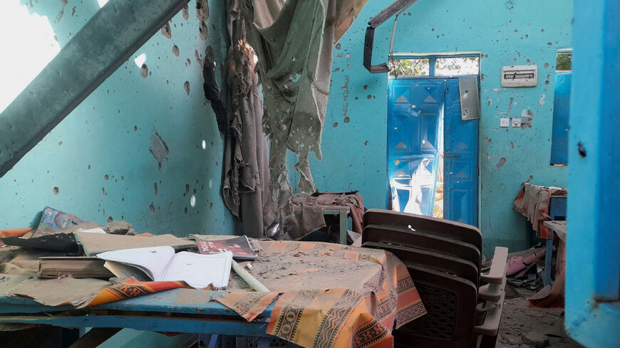 A desk bearing signs of shelling in a school where displaced people are sheltering, in El Fasher, Sudan, October 7, 2025. REUTERS/Mohyaldeen M Abdallah